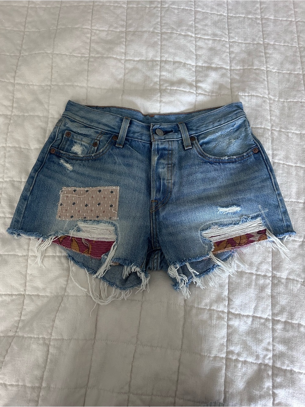 Adorable light wash patchwork Levi’s cutoff denim shorts